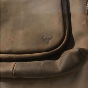 James leather sling bag never used retail $169